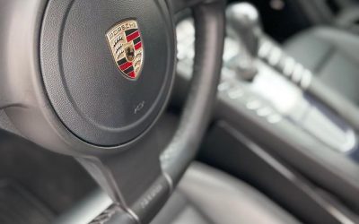 Clean Porsche steering wheel and logo