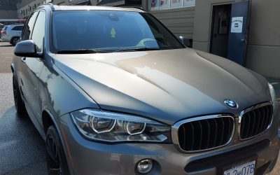 A silver BMW after vehicle detailing