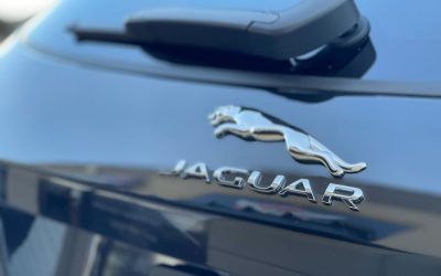 Black car with shiny Jaguar logo